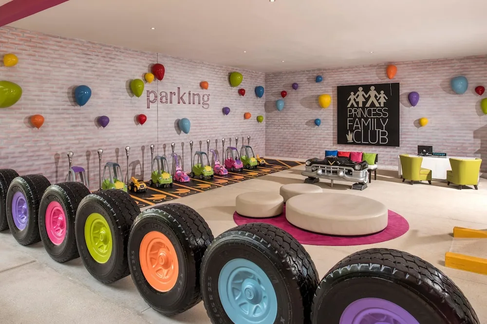 A toy parking play area with scooters and tires at Princess Family Club Riviera.