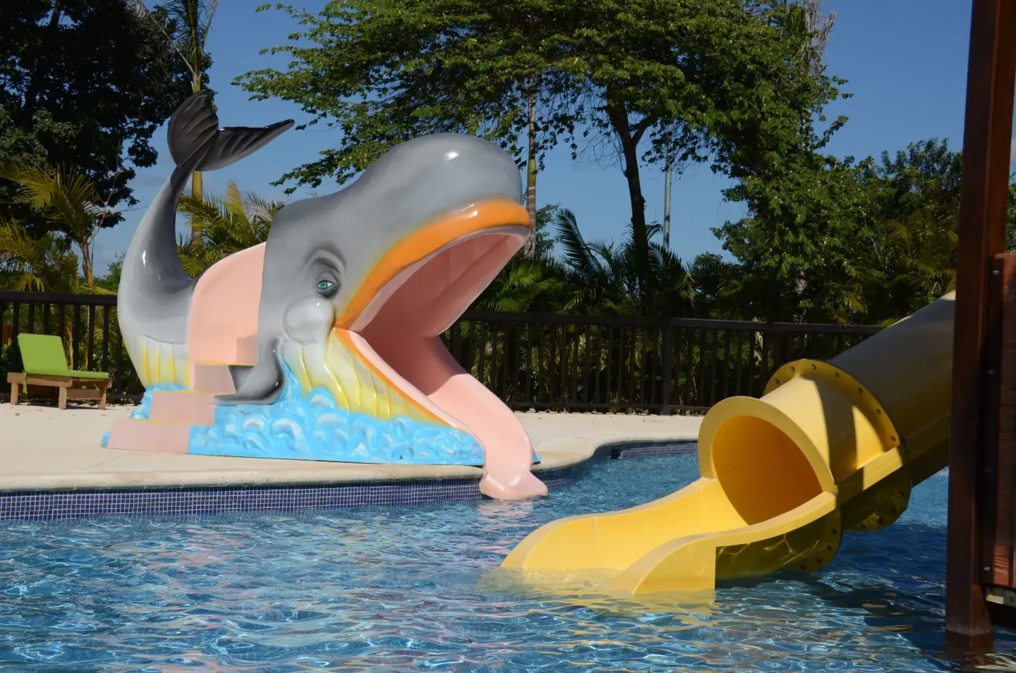 Whale slide and yellow slide meet the splash pool at Princess Family Club Riviera.