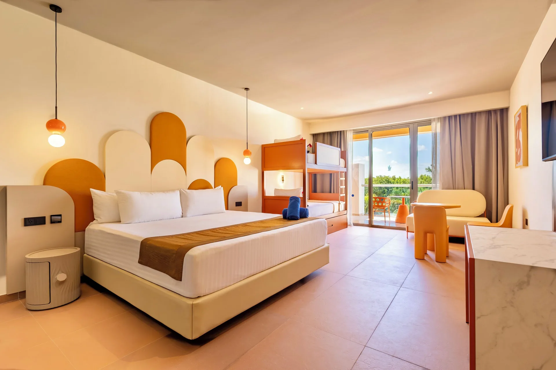 Family Room with king bed, bunk beds and balcony at Princess Family Club Riviera.