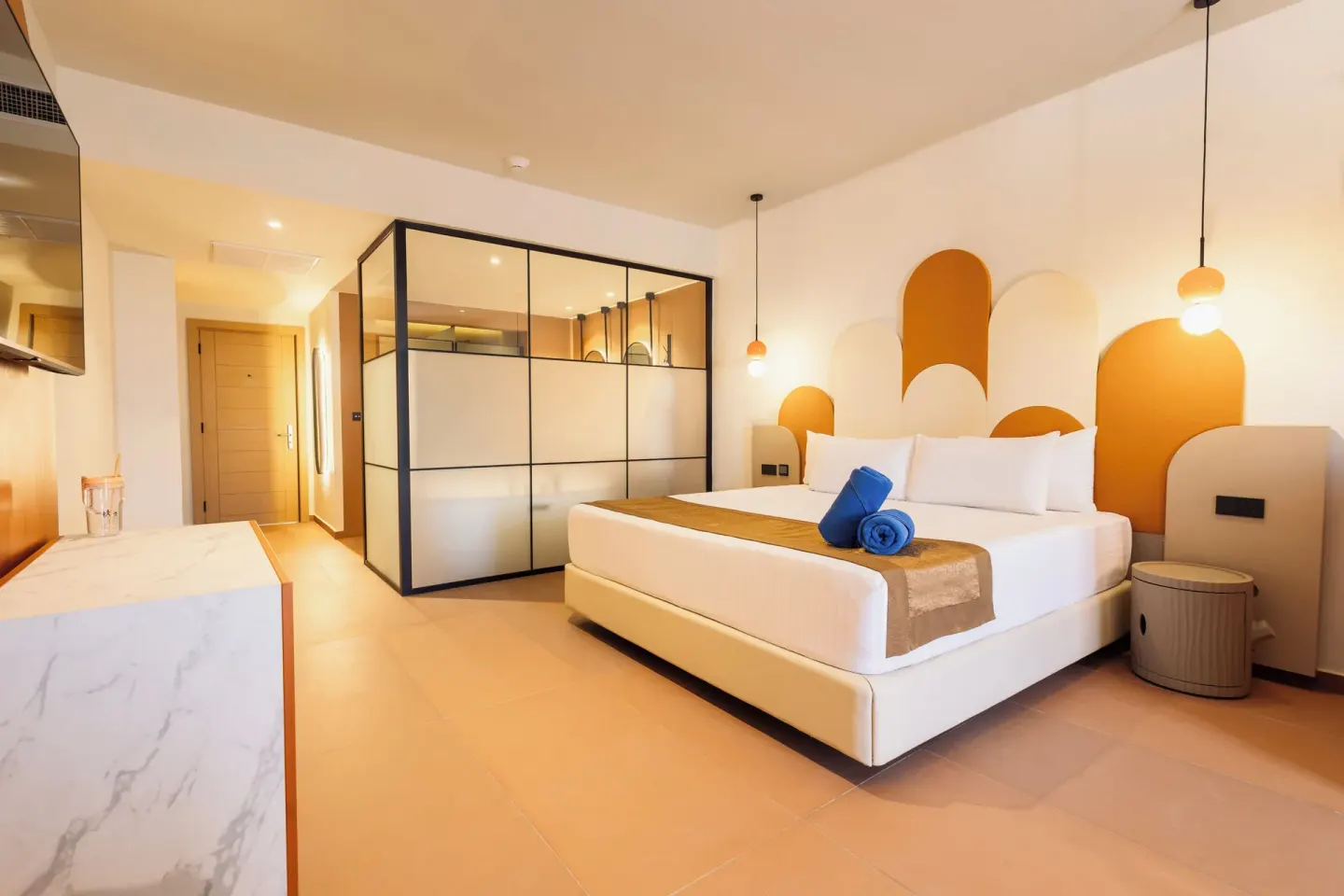 Family Room king bed and glass-partitioned bathroom area at Princess Family Club Riviera.
