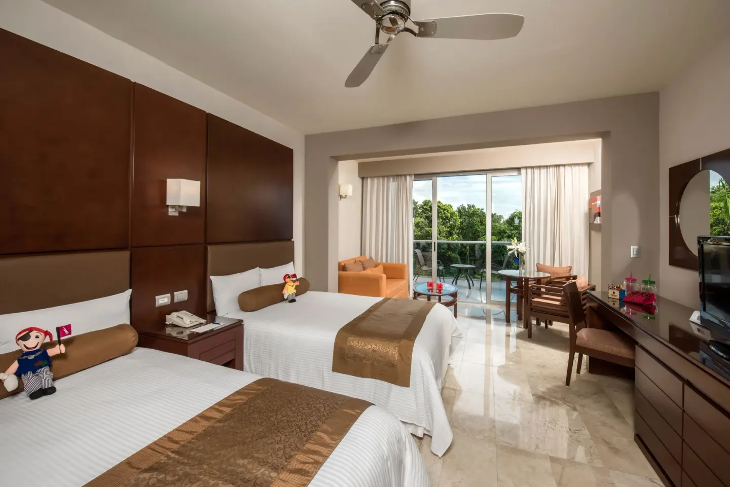 Family Room with two double beds and balcony doors at Princess Family Club Riviera.