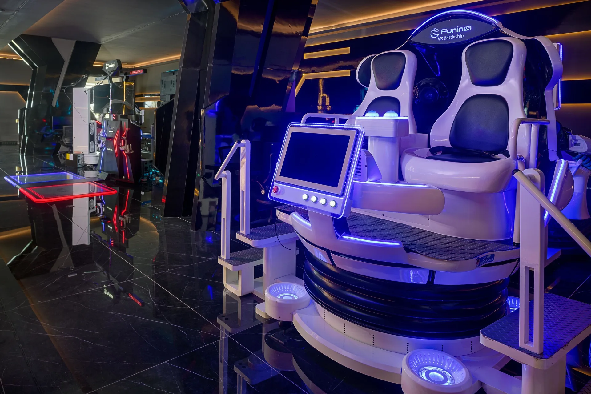 VR ride seats and arcade games at Princess Grand Jamaica Resort.