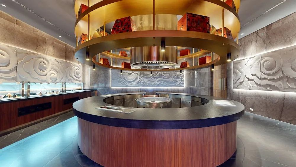 Circular show-cooking counter in an Asian-style restaurant at Princess Grand Jamaica Resort.