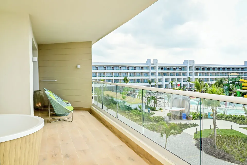 Imperial 1 Bedroom Master Suite balcony overlooking resort grounds at Princess Grand Jamaica Resort.