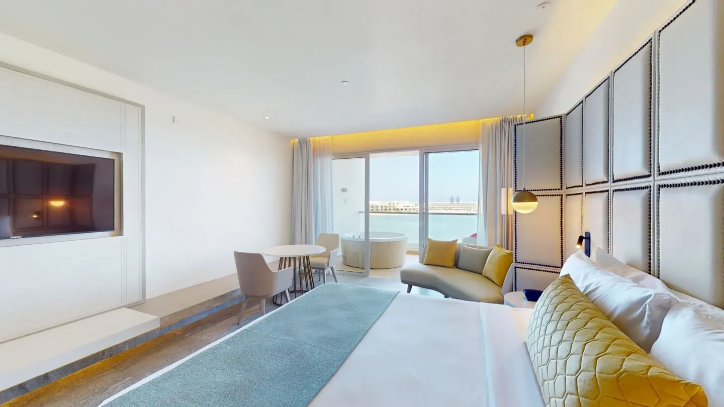 King bed guest room with TV wall and balcony tub at Princess Senses The Mangrove Resort.