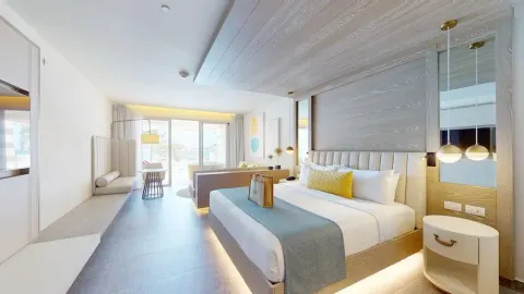 King guest room with seating area at Princess Senses The Mangrove Resort.