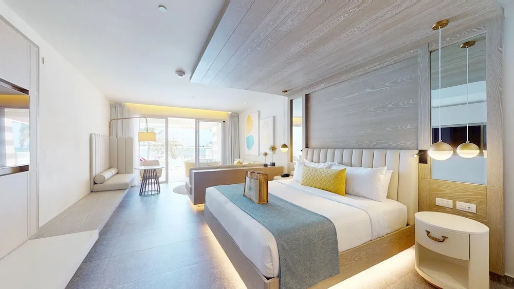 King guest room with seating area at Princess Senses The Mangrove Resort.
