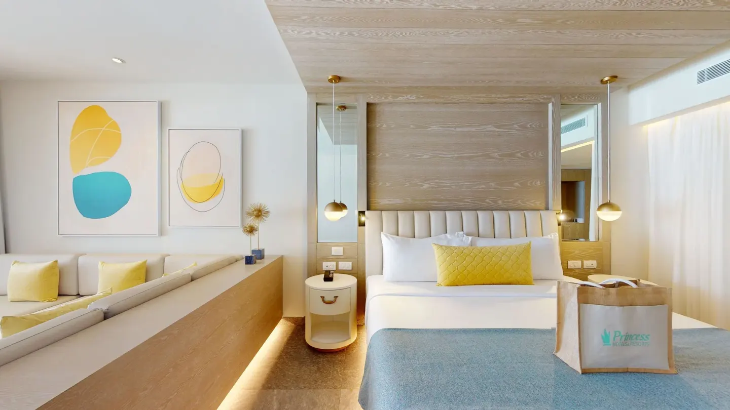 Modern king-bed suite with wall art at Princess Senses The Mangrove Resort.