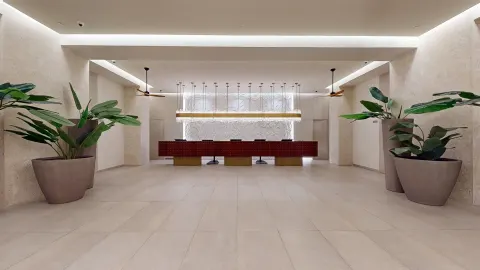 Reception desk and potted plants in the lobby at Princess Senses The Mangrove Resort.