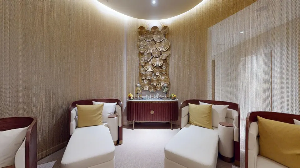 Spa lounge with chaise seating and gold wall art at Princess Senses The Mangrove Resort.