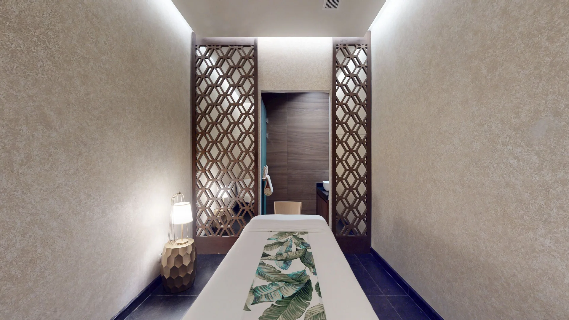 Spa treatment room with massage table at Princess Senses The Mangrove Resort.