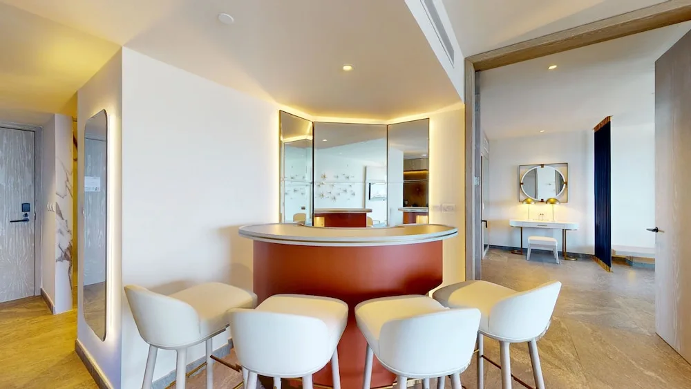 In-room bar counter with stools in a suite at Princess Senses The Mangrove Resort.