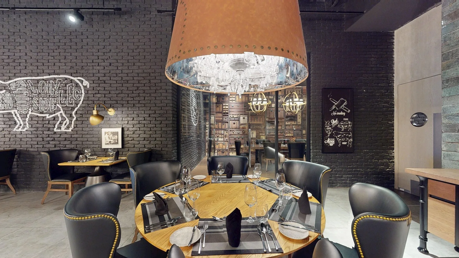 Steakhouse dining room with round table at Princess Senses The Mangrove Resort.