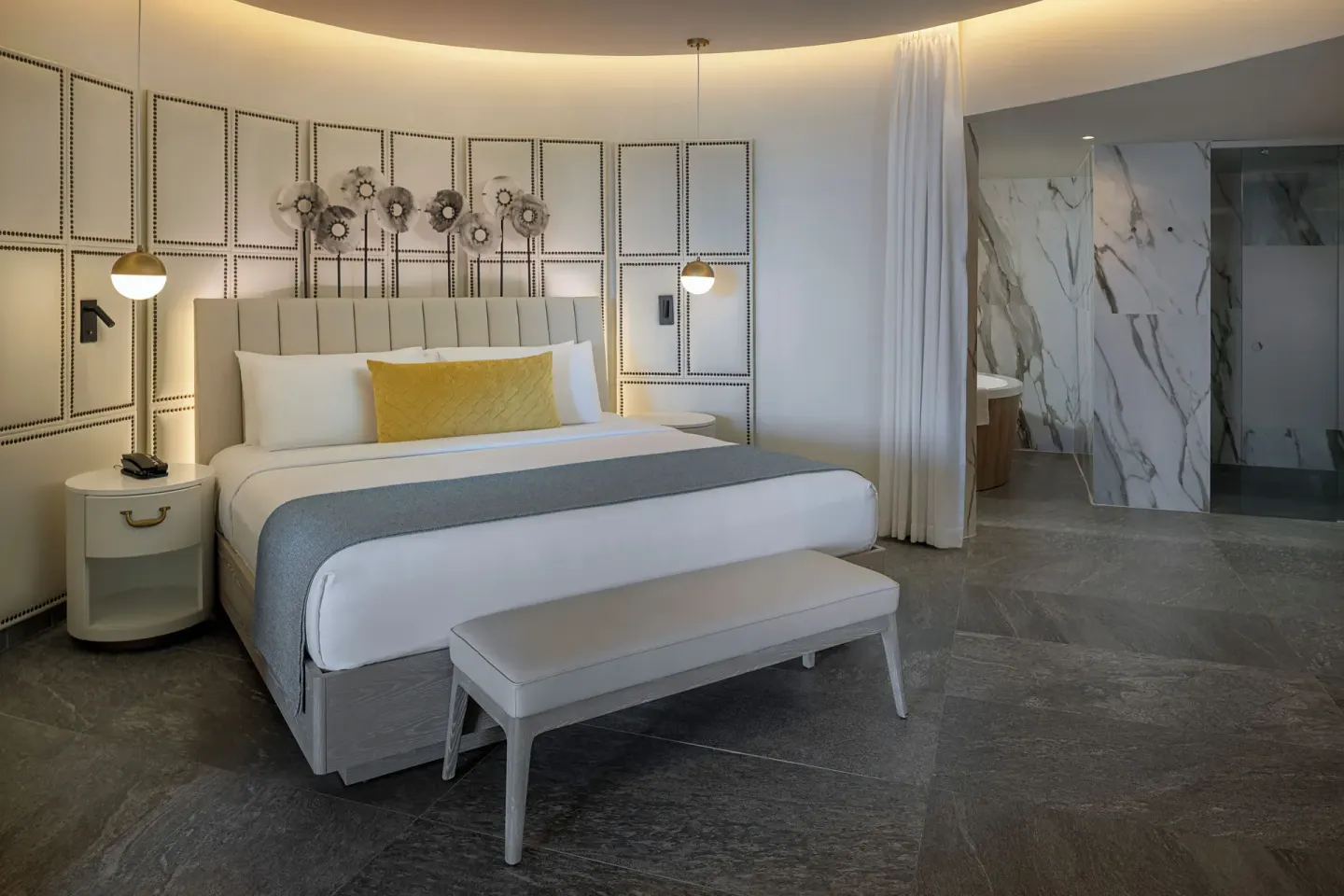 Luxury Junior Suite king bed and marble bathroom at Princess Senses The Mangrove Resort.