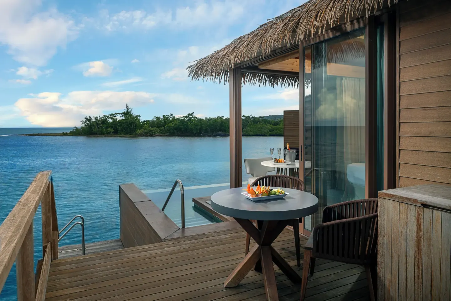 Private deck and infinity pool of an Overwater Villa at Princess Senses The Mangrove Resort.