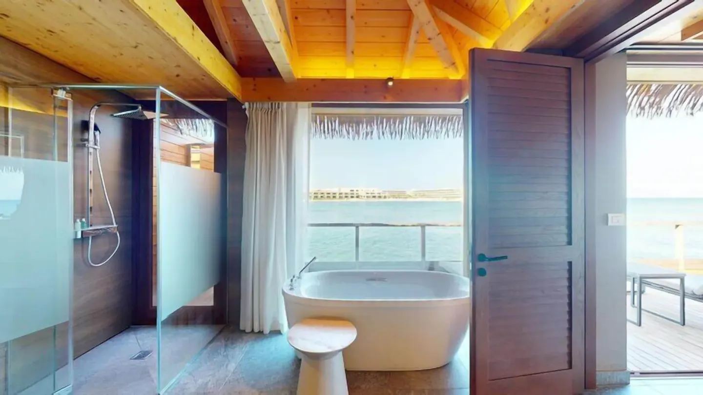 Overwater Villa bathroom with tub and sea view at Princess Senses The Mangrove Resort.