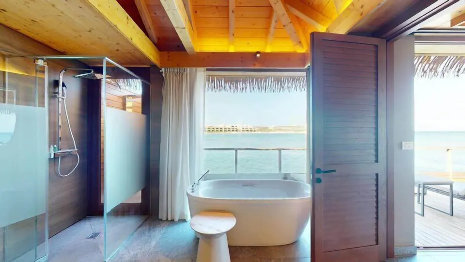 Overwater Villa bathroom with tub and sea view at Princess Senses The Mangrove Resort.