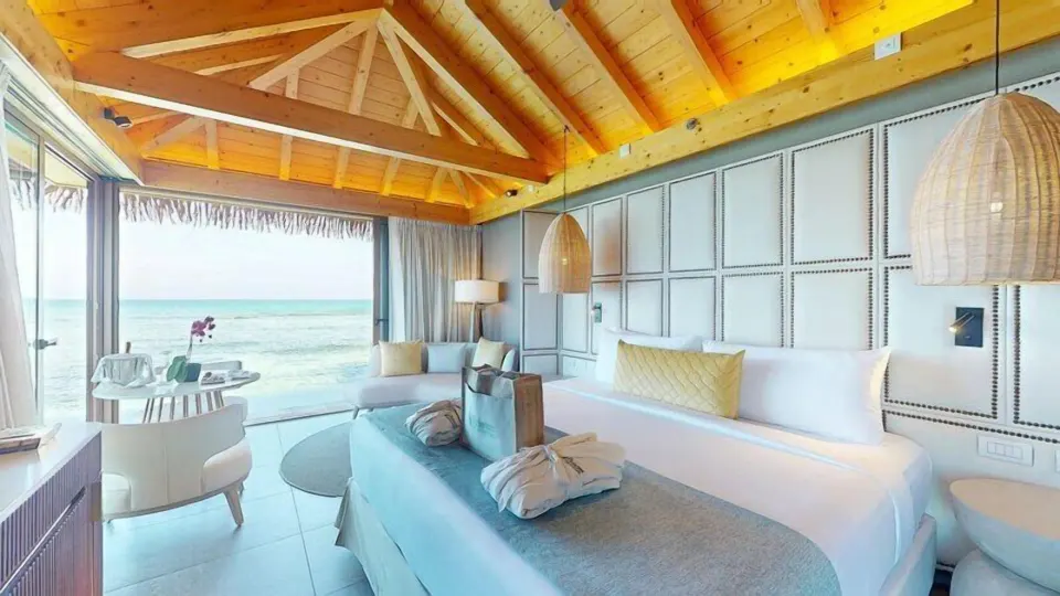 Overwater Villa king bedroom with oceanfront windows at Princess Senses The Mangrove Resort.