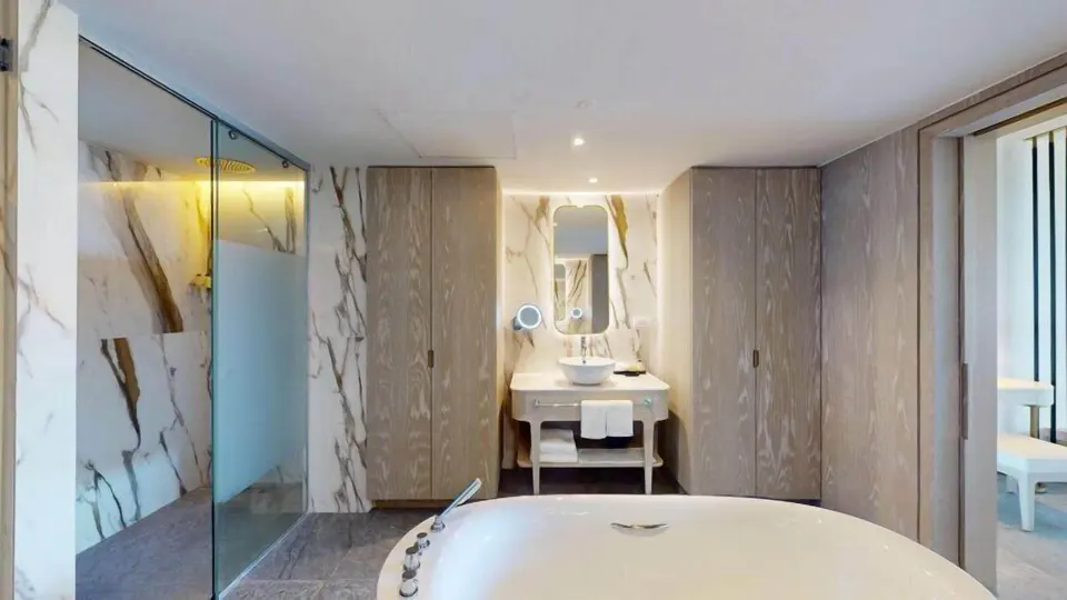 Platinum Master Suite bathroom with tub, shower, and vanity at Princess Senses The Mangrove Resort.