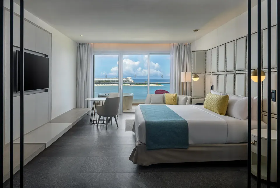 Platinum Master Suite bedroom with king bed and sea view at Princess Senses The Mangrove Resort.
