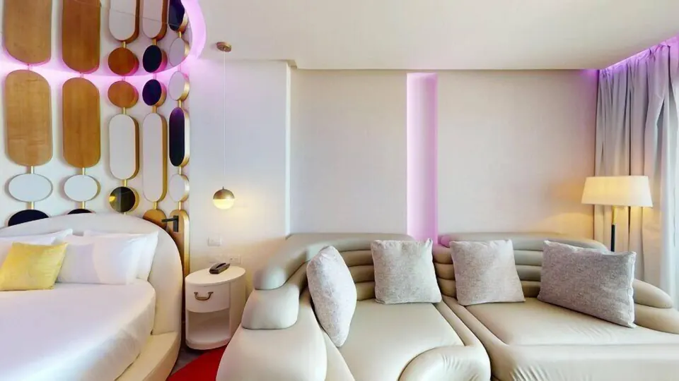 Pleasure Junior Suite bed and sofa seating at Princess Senses The Mangrove Resort.