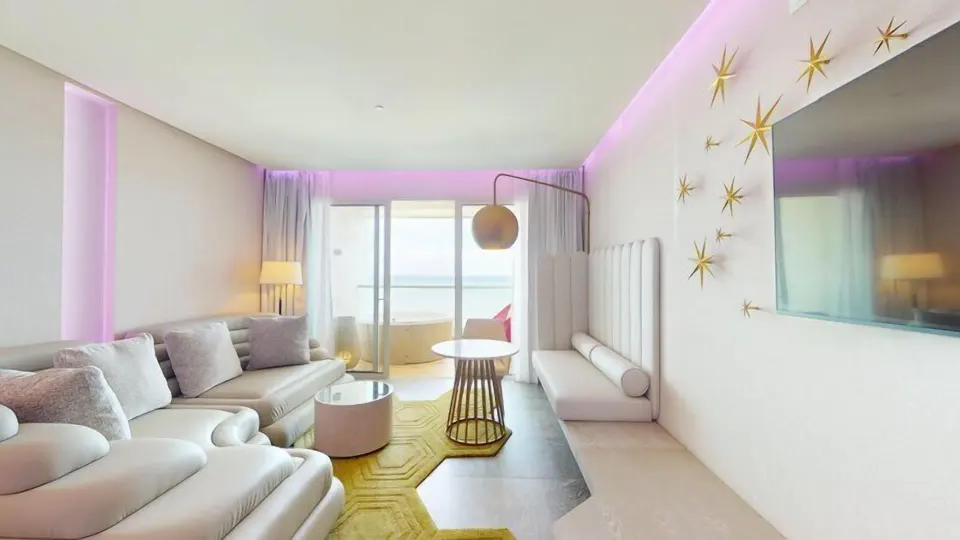 Pleasure Junior Suite lounge with balcony doors at Princess Senses The Mangrove Resort.