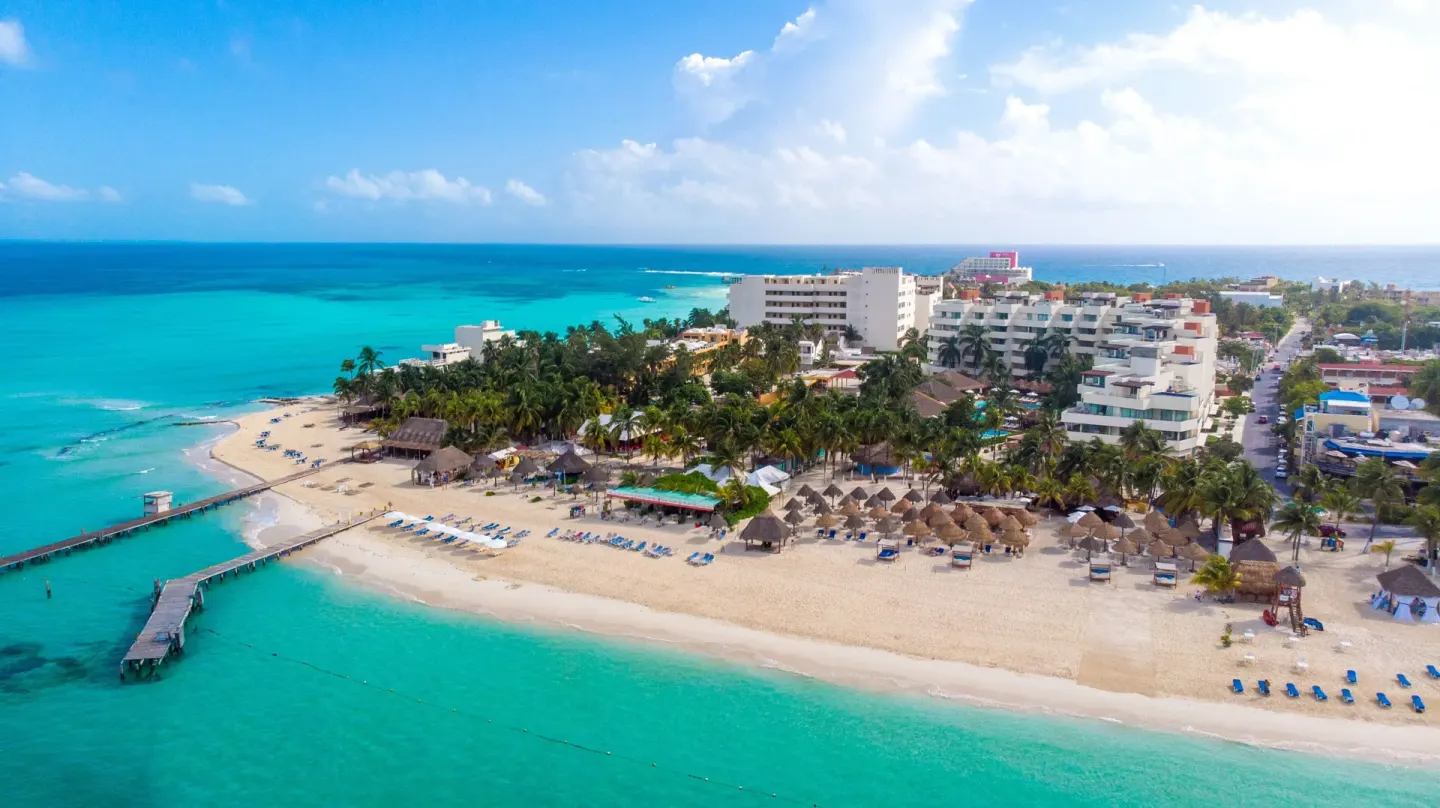 Aerial view of the beach and turquoise water at Privilege Aluxes Isla Mujeres.