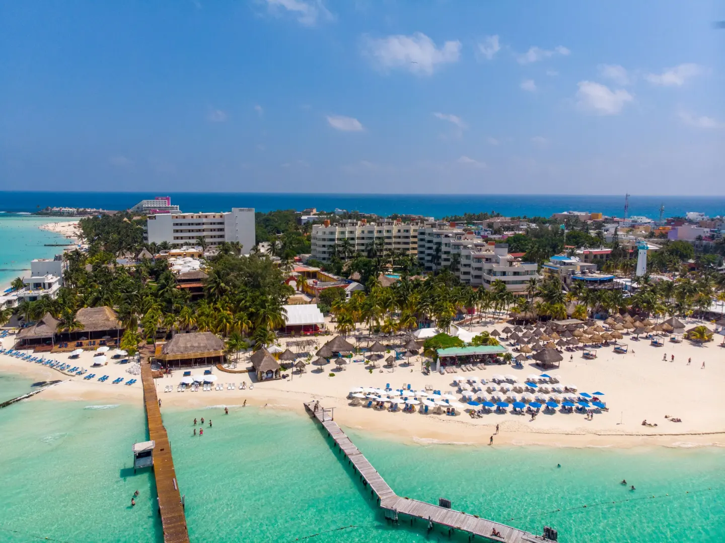 Aerial beachfront view of Privilege Aluxes Isla Mujeres and turquoise water.