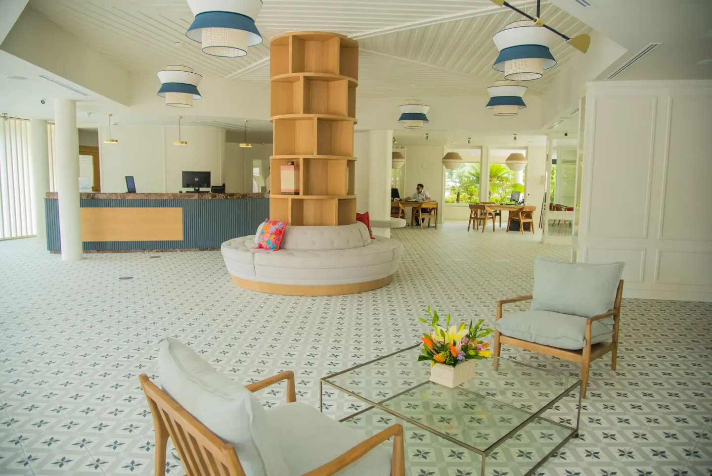 Bright lobby with patterned tile and seating at Privilege Aluxes Isla Mujeres.