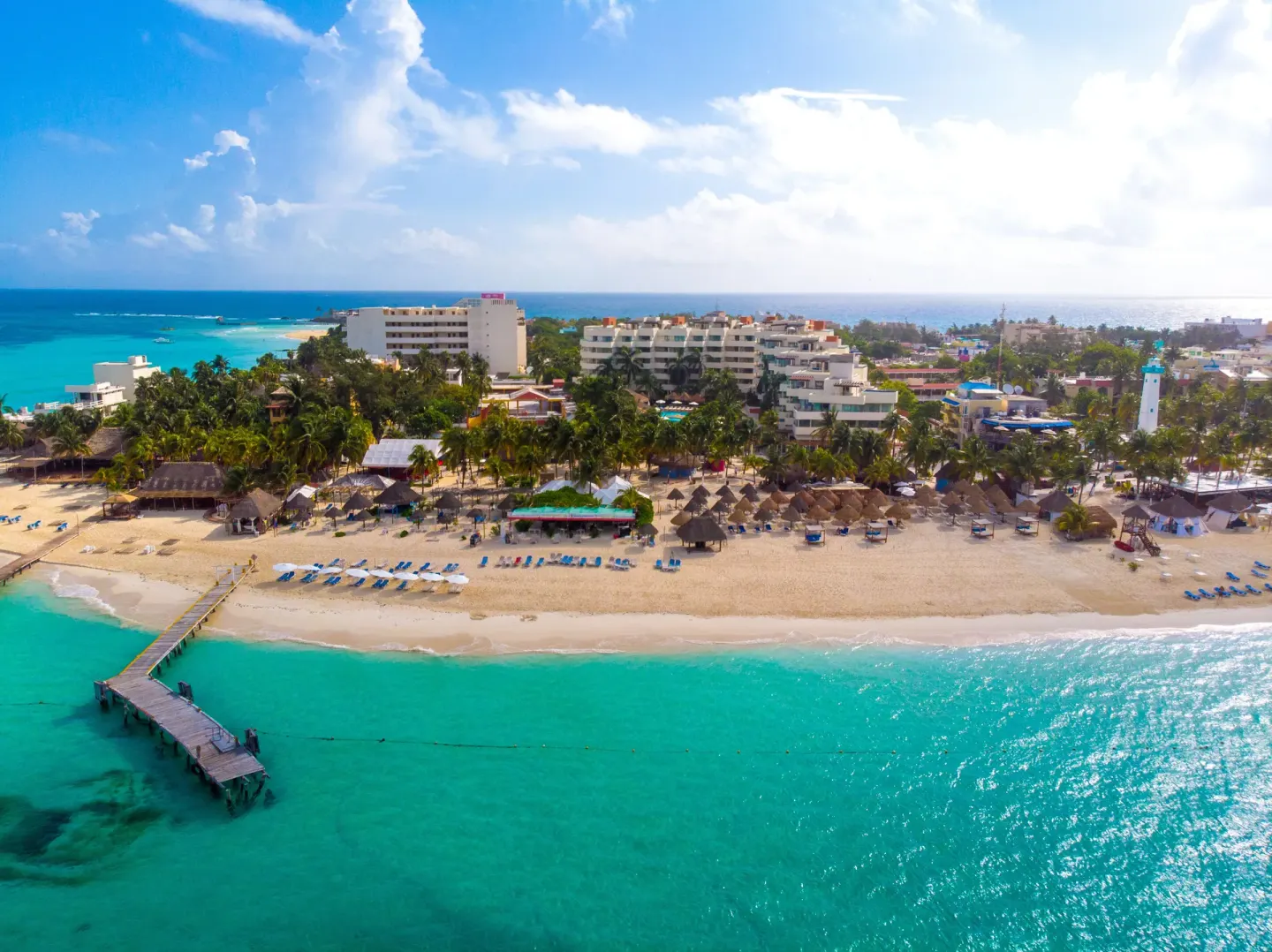 Sunlit aerial view of the beach at Privilege Aluxes Isla Mujeres.