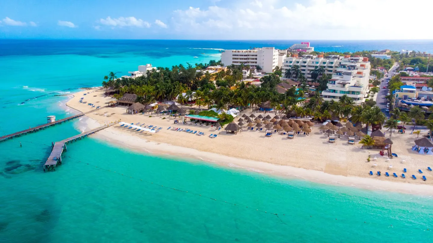 Wide aerial view of the beachfront and resort area at Privilege Aluxes Isla Mujeres.