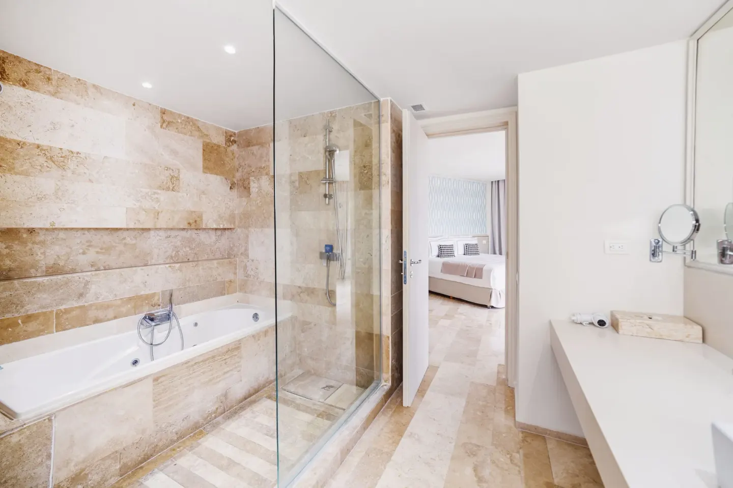 Deluxe Suite Garden View bathroom looking toward bedroom at Privilege Aluxes Isla Mujeres.