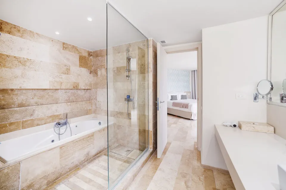 Deluxe Suite Garden View bathroom looking toward bedroom at Privilege Aluxes Isla Mujeres.