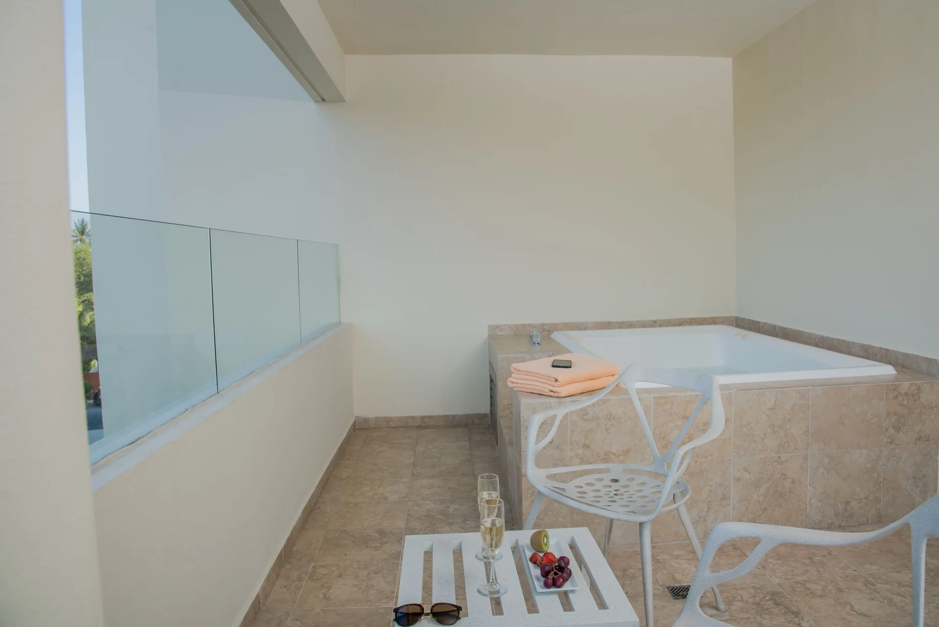 Superior Aluxes balcony with whirlpool tub and seating at Privilege Aluxes Isla Mujeres.