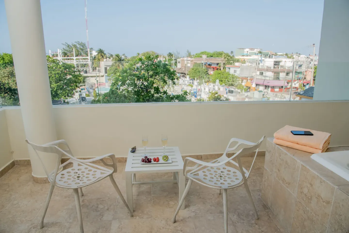 Superior Aluxes balcony seating and whirlpool with town view at Privilege Aluxes Isla Mujeres.