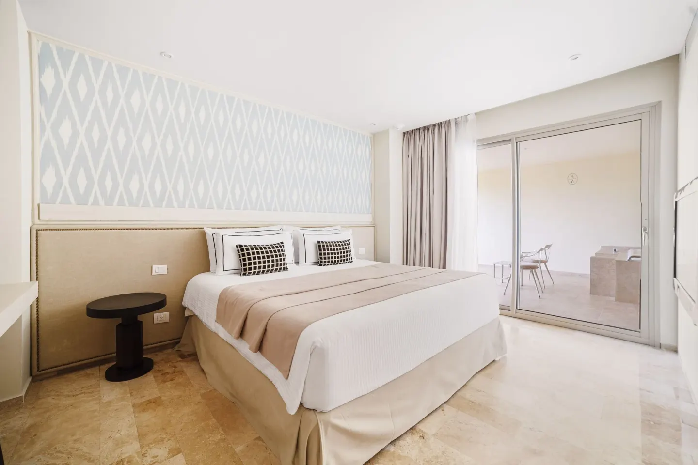 Superior Aluxes king bed room with sliding doors to a balcony at Privilege Aluxes Isla Mujeres.