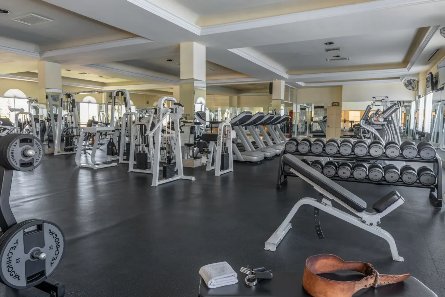 Large fitness room with treadmills, dumbbells, and benches at Pueblo Bonito Los Cabos Blanco.