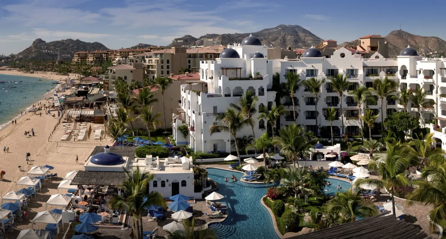 Pool, palms, and beachfront buildings at Pueblo Bonito Los Cabos Blanco.