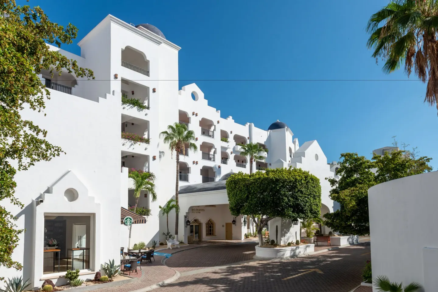 White resort facade and driveway entrance at Pueblo Bonito Los Cabos Blanco.