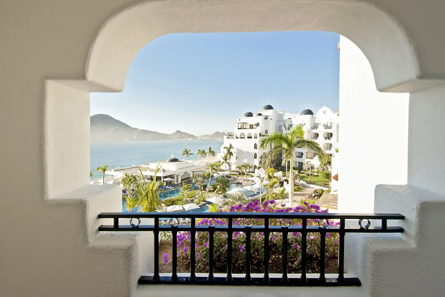Junior Suite Ocean View balcony arch overlooking pools and coastline at Pueblo Bonito Los Cabos Blanco.