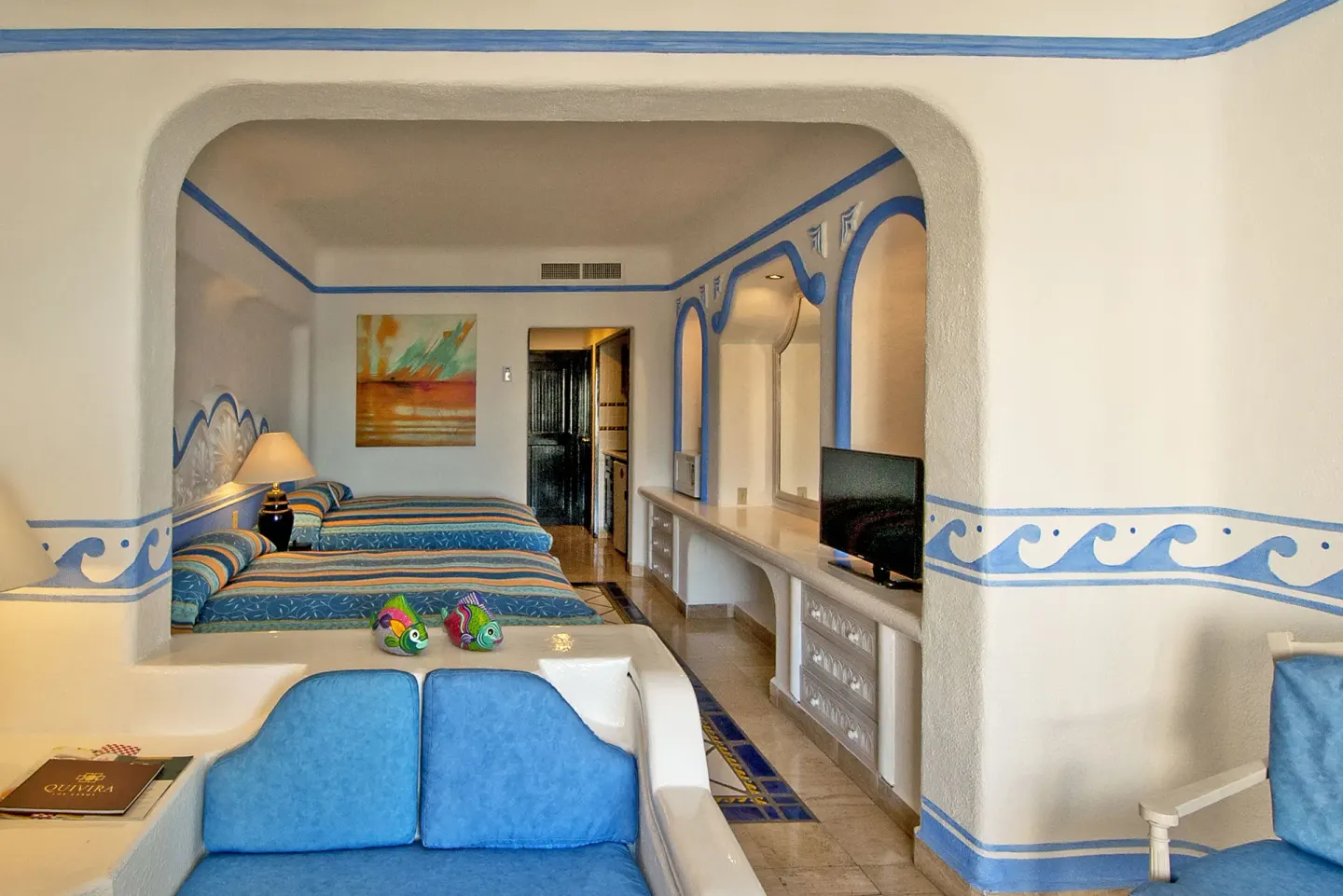 Junior Suite Ocean View lounge and two-bed sleeping area at Pueblo Bonito Los Cabos Blanco.