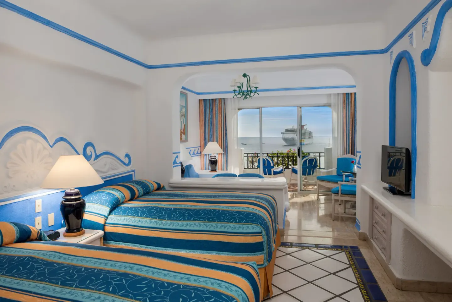 Junior Suite Ocean View with two beds, TV, and balcony at Pueblo Bonito Los Cabos Blanco.
