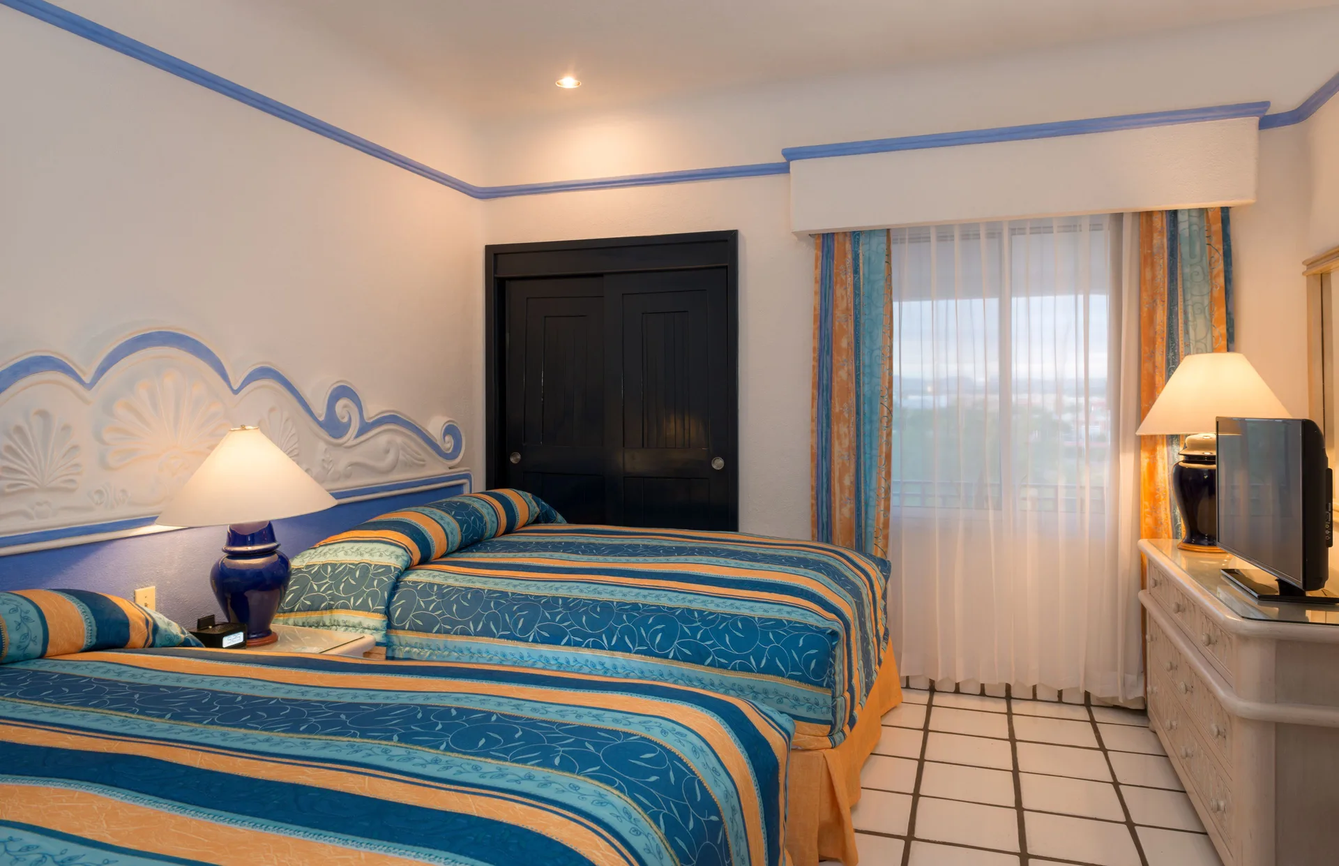 Luxury Suite bedroom with two beds at Pueblo Bonito Los Cabos Blanco.