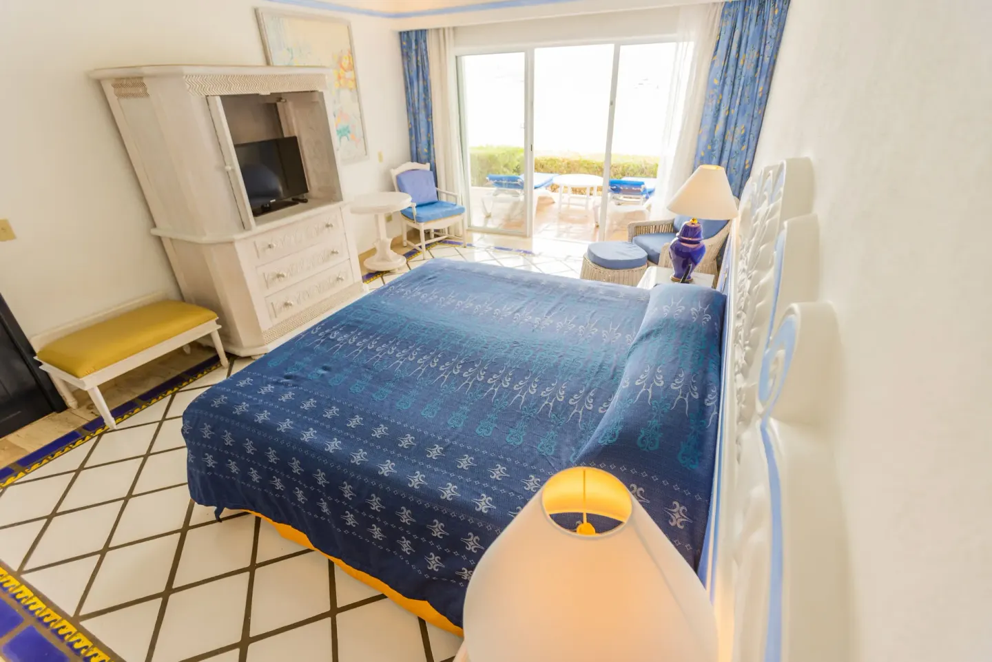 Master Suite Ocean View bedroom with blue bedspread at Pueblo Bonito Los Cabos Blanco.