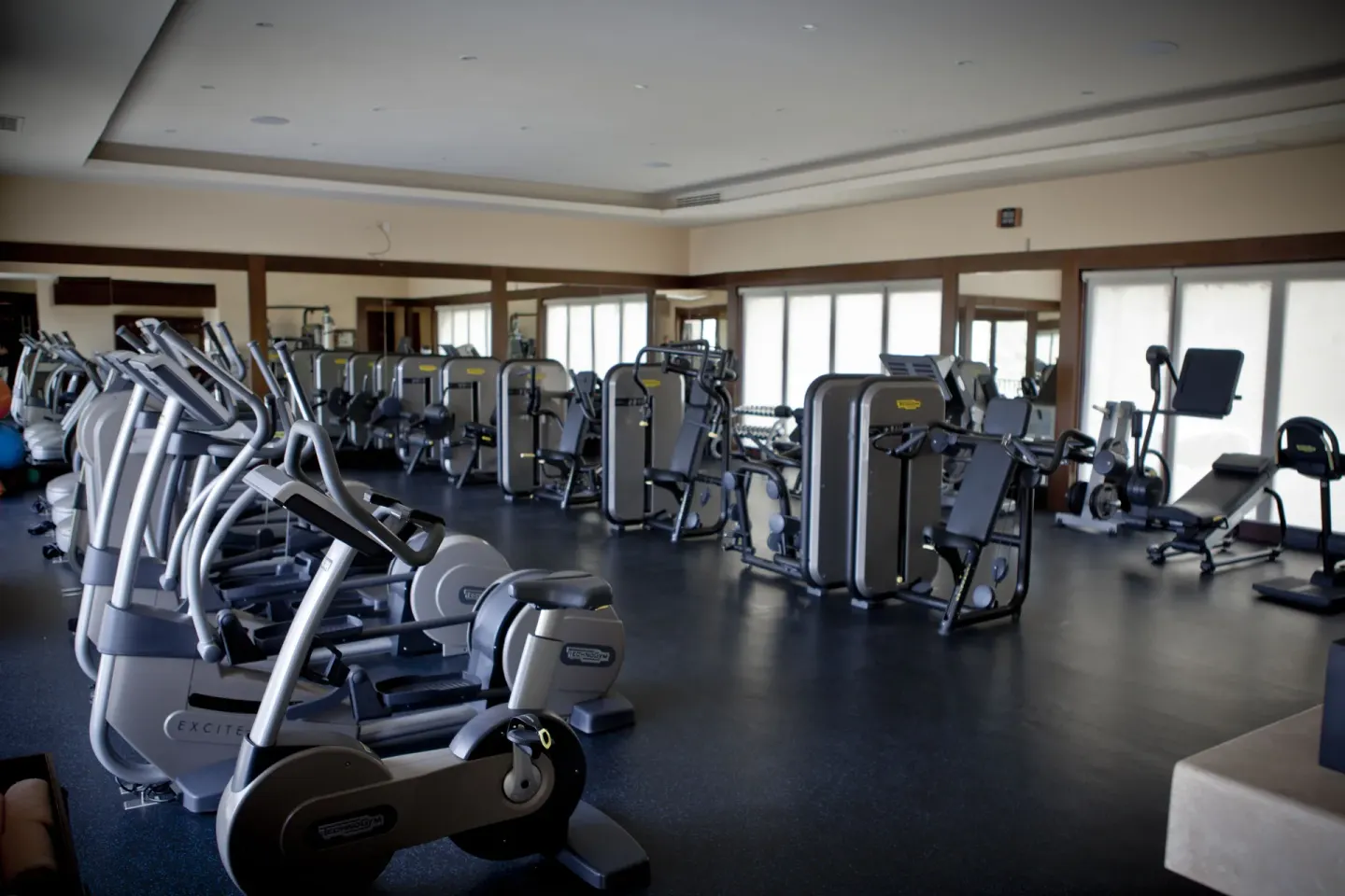 Gym floor with exercise machines and mirrors at Pueblo Bonito Montecristo Luxury Villas.