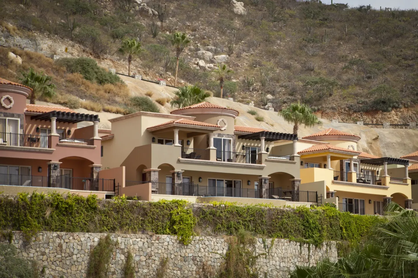 Hillside villas with balconies at Pueblo Bonito Montecristo Luxury Villas.