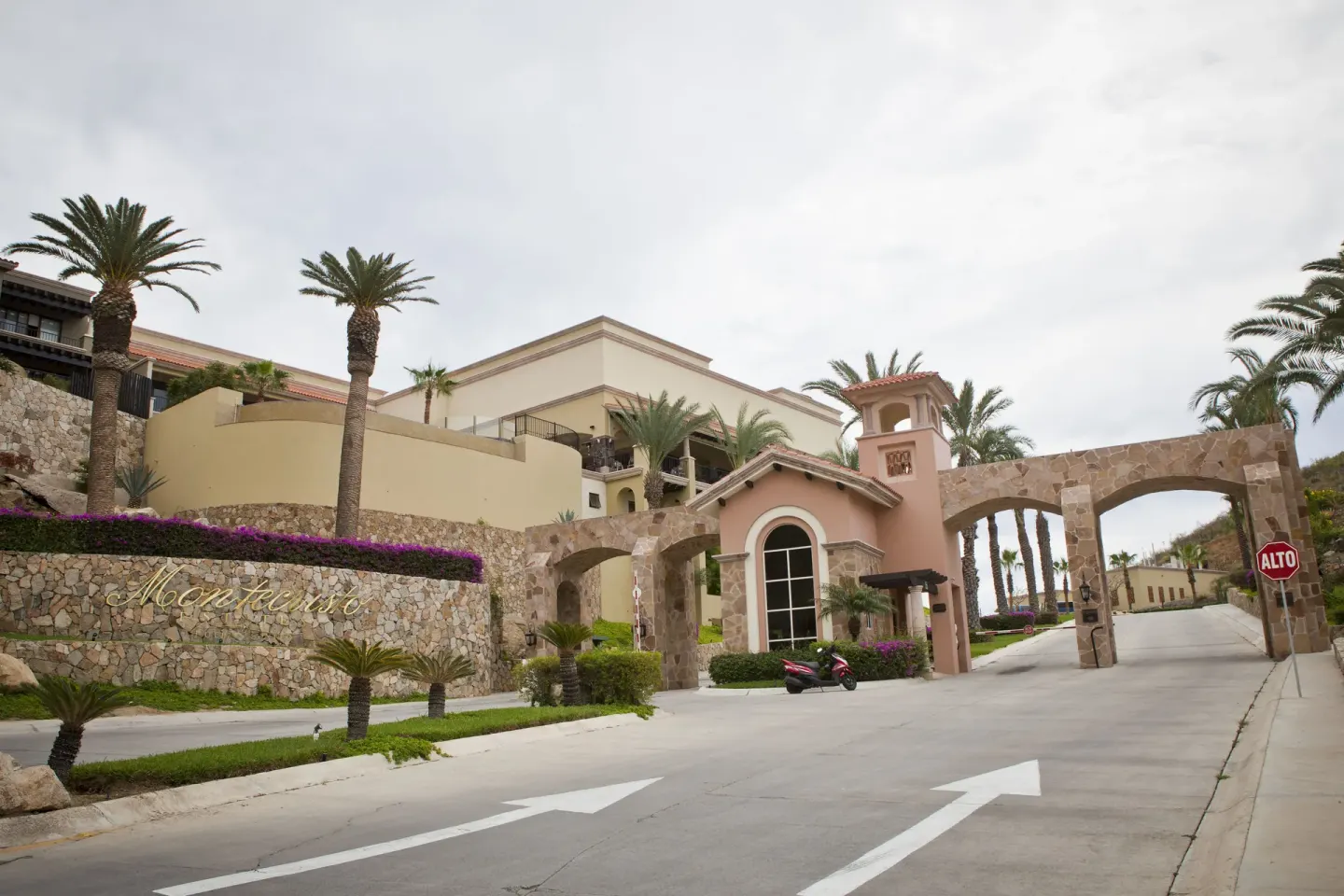 Resort entry road and stone archway at Pueblo Bonito Montecristo Luxury Villas.