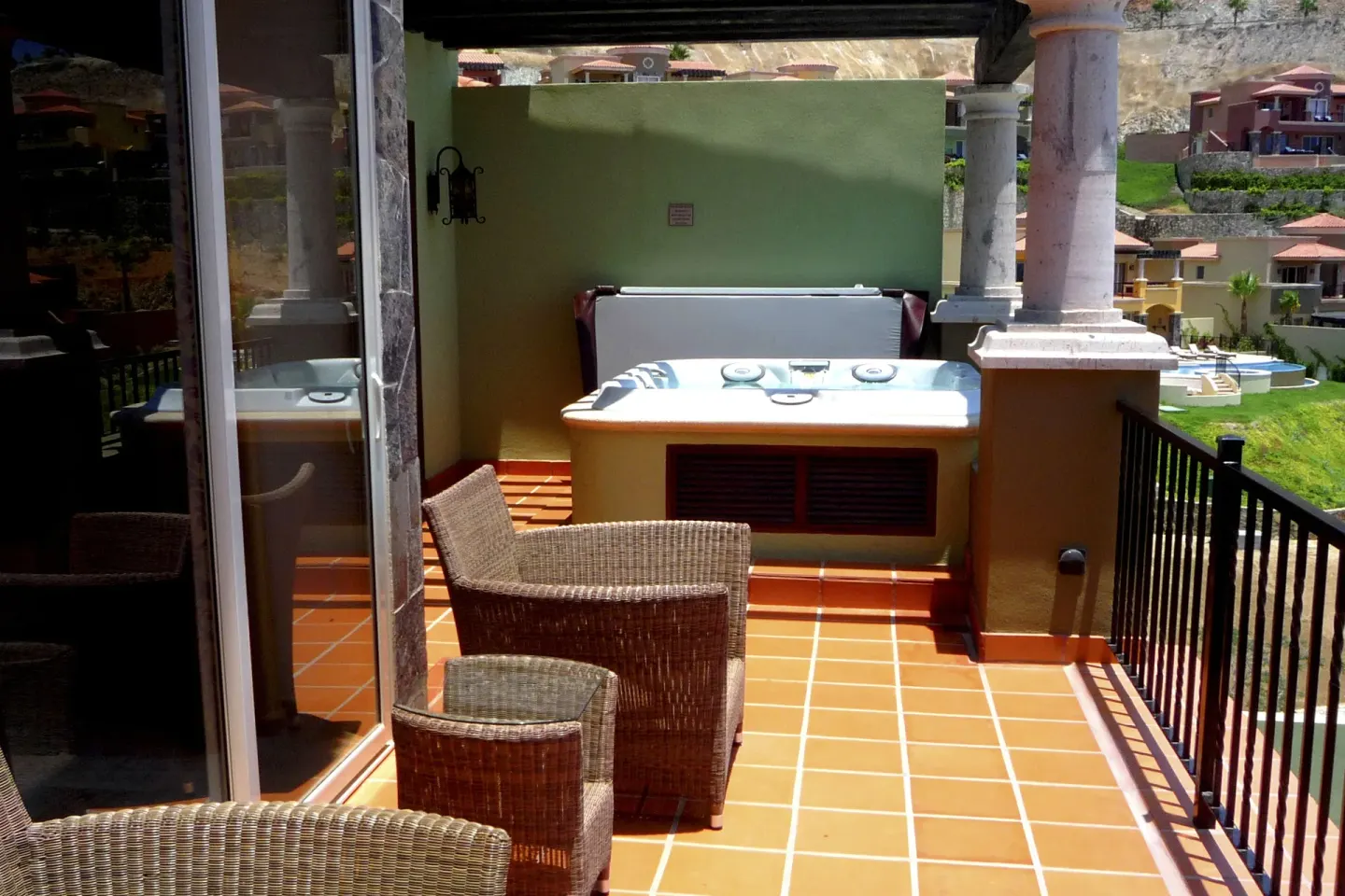 Villa terrace with hot tub and wicker seating at Pueblo Bonito Montecristo Luxury Villas.