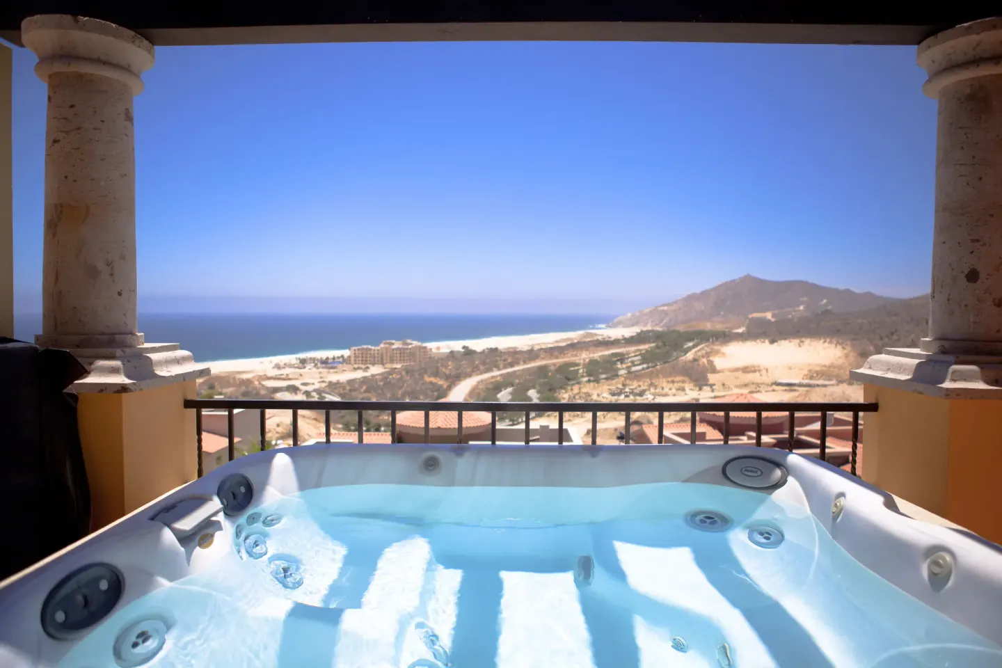 Terrace hot tub with ocean and coastline view at Pueblo Bonito Montecristo Luxury Villas.