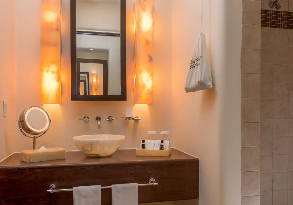 Deluxe Room bathroom vanity and shower at Pueblo Bonito Pacifica Golf & Spa Resort.